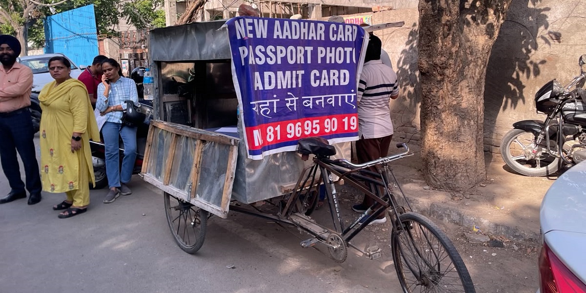 Small Printer cart outside CUET examination centre helping students with documents and admit cards before exam